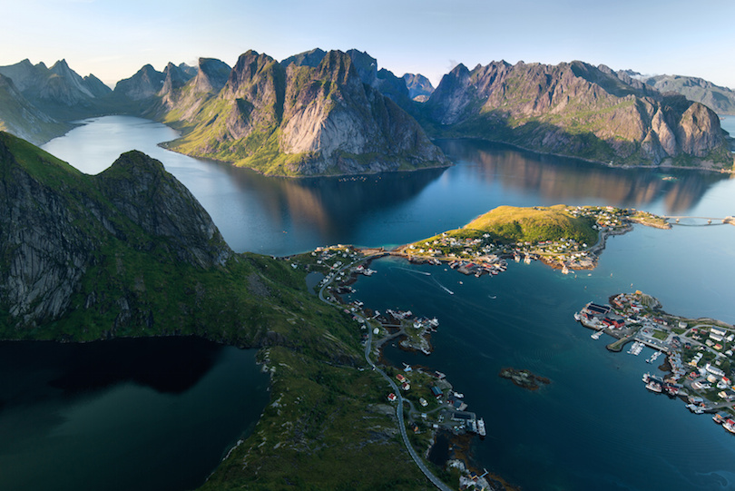 Scenic landscape of Lofoten islands: peaks, lakes, and houses